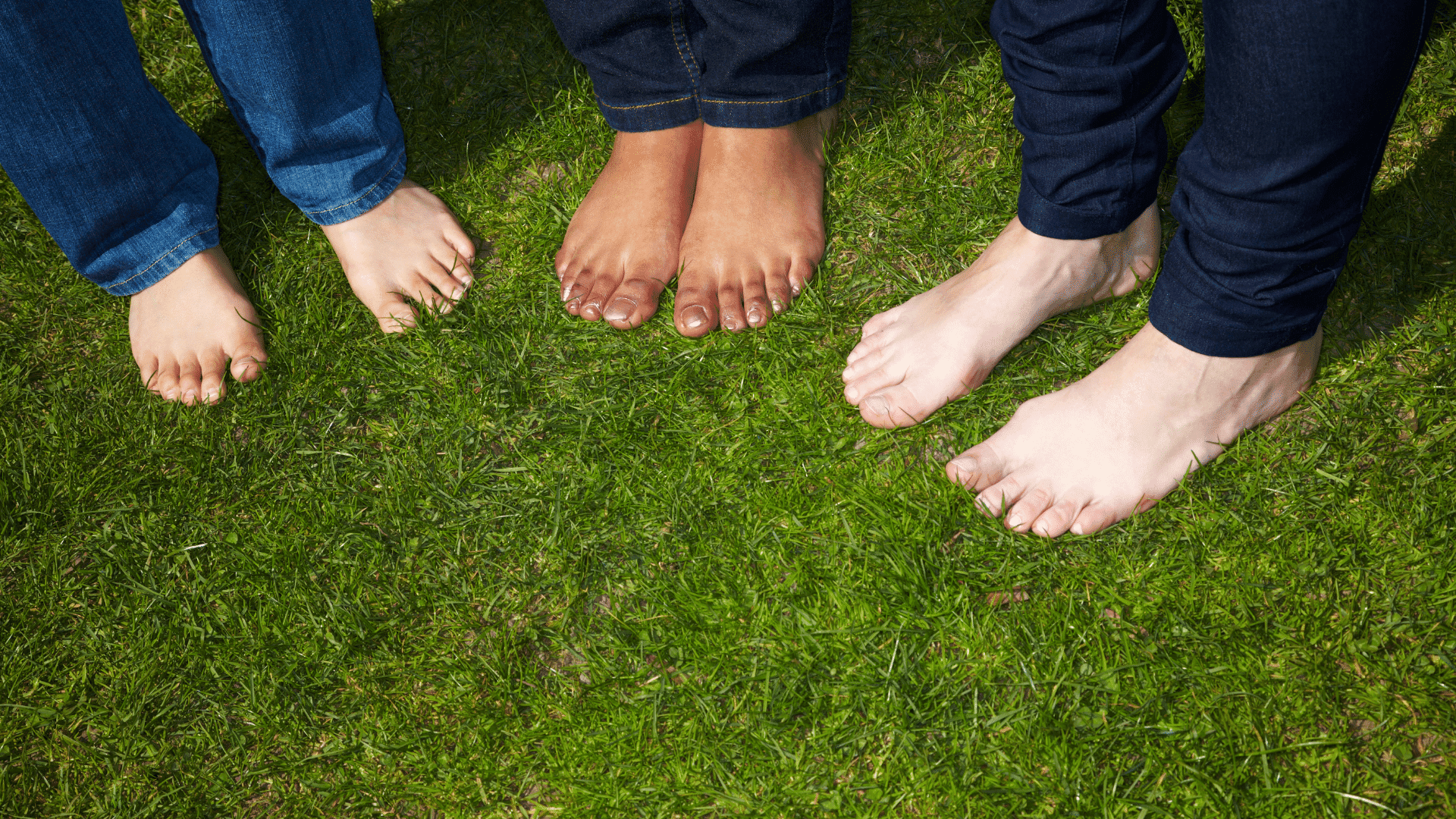 Bare feet grounded on grass