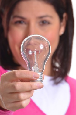 bigstock-Woman-holding-a-bulb-lamp-Ener-40776439
