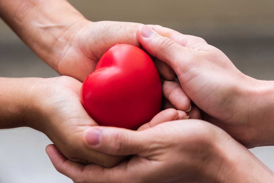 rickthrivingnow_detailed_image_a_hand_giving_a_rich_blood_red_c_37e41476-9b9c-4662-9807-e56a282871cd